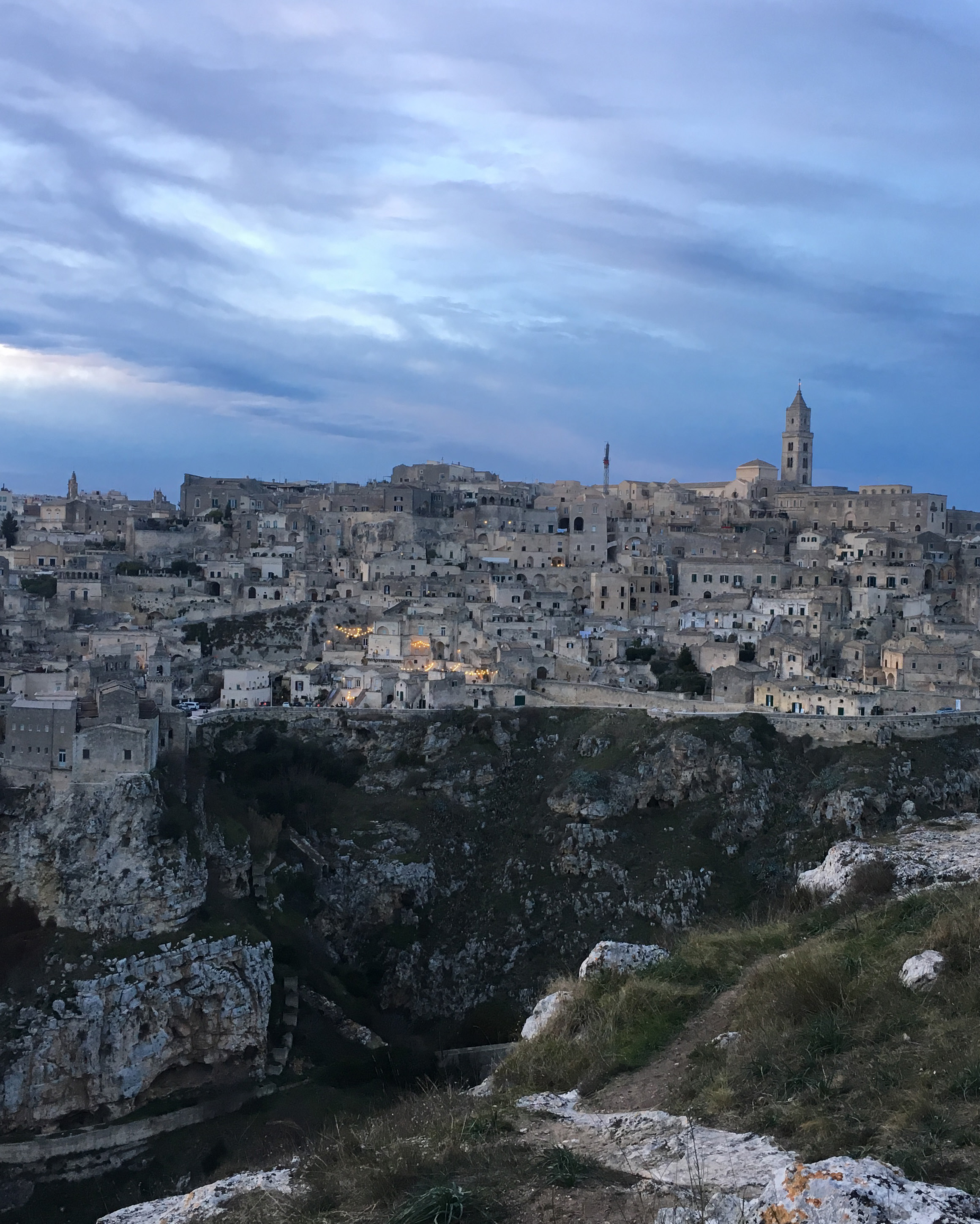 View of the Sassi di Matera from Belvedere Murgia Timone; in the foreground is the canyon of the stream Torrente Gravina (Source: Isabella Banfi, 2022).